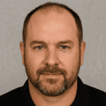 Professional headshot of Eric Daniels, Facilities Director from Raleigh, NC