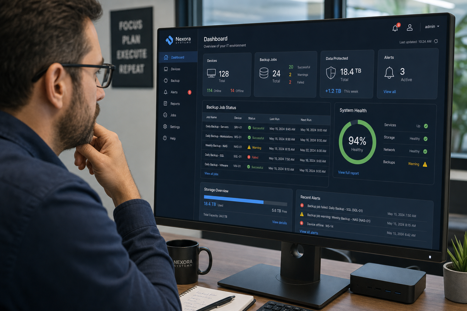 IT technician reviewing backup and disaster recovery monitoring dashboard in a Central Florida business office